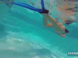 Grand brunette hooker Candy swims underwater